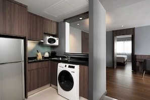 Enjoy a compact room with a kitchenette, washer, and dryer for added convenience.