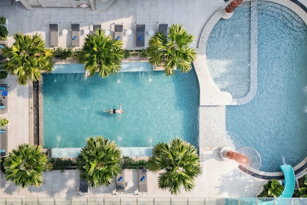 Outdoor pool, open 6:00 AM to 10:00 PM, pool umbrellas, pool loungers