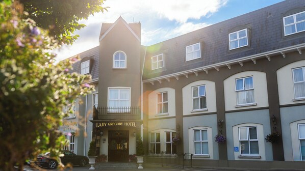 A multi-story hotel with a classic architectural design, featuring a prominent entrance and a sign reading "Lady Gregory Hotel". - Lady Gregory Hotel, Leisure Club & Beauty Rooms (Gort)