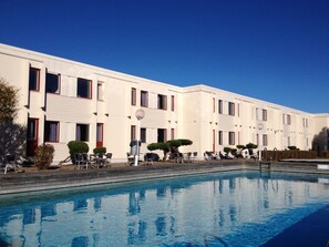 Seasonal outdoor pool, pool loungers