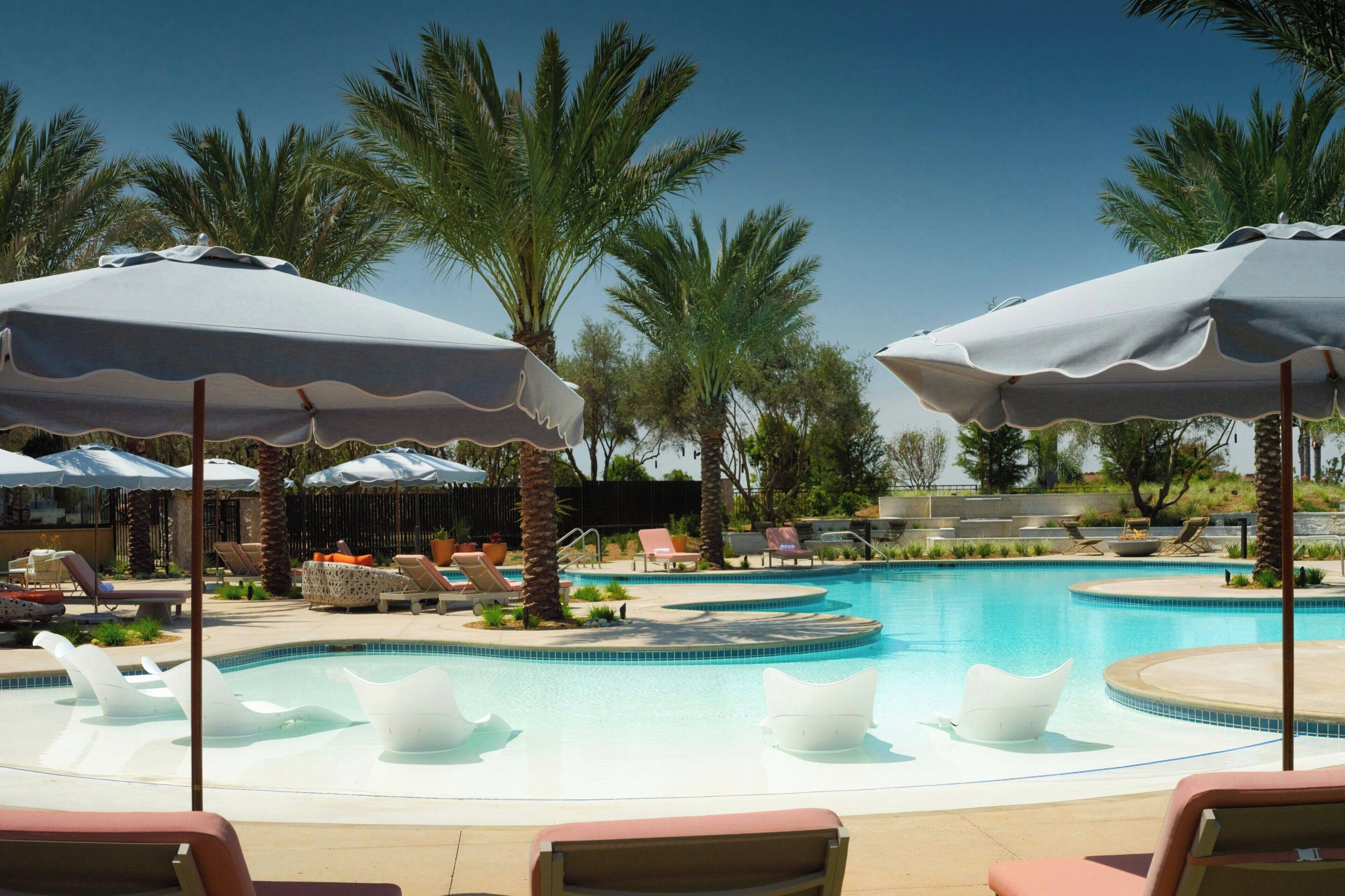 Outdoor pool, open 7:00 AM to 10:00 PM, pool umbrellas, sun loungers