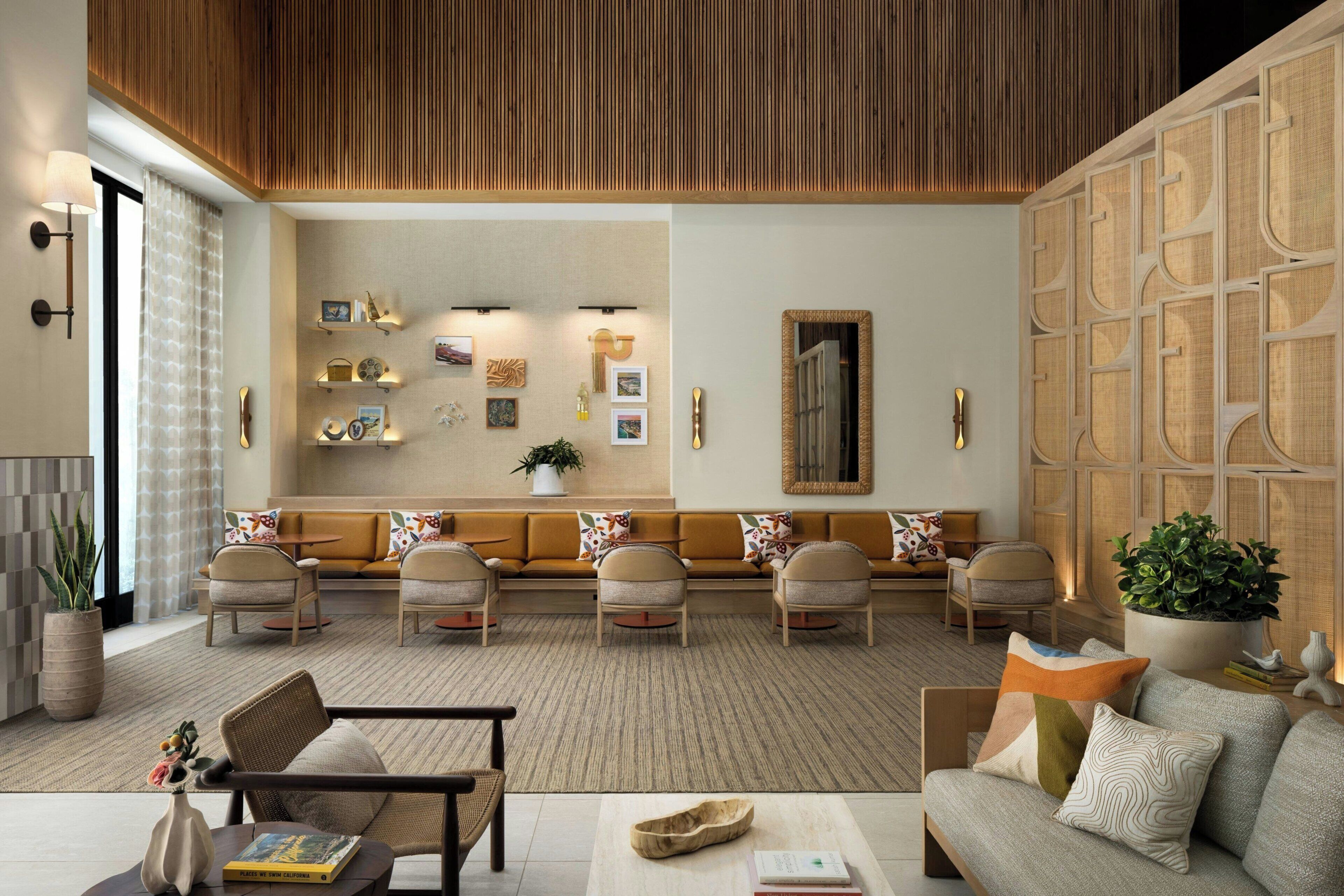 A modern living room with a sofa set, a coffee table, and a fireplace.