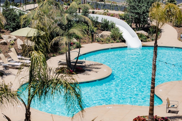 Outdoor pool, open 7:00 AM to 10:00 PM, pool umbrellas, sun loungers