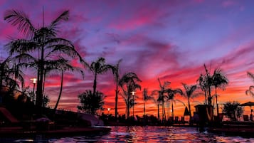 Outdoor pool, open 7:00 AM to 10:00 PM, pool umbrellas, pool loungers