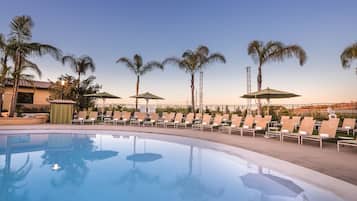 Outdoor pool, open 7:00 AM to 10:00 PM, pool umbrellas, sun loungers