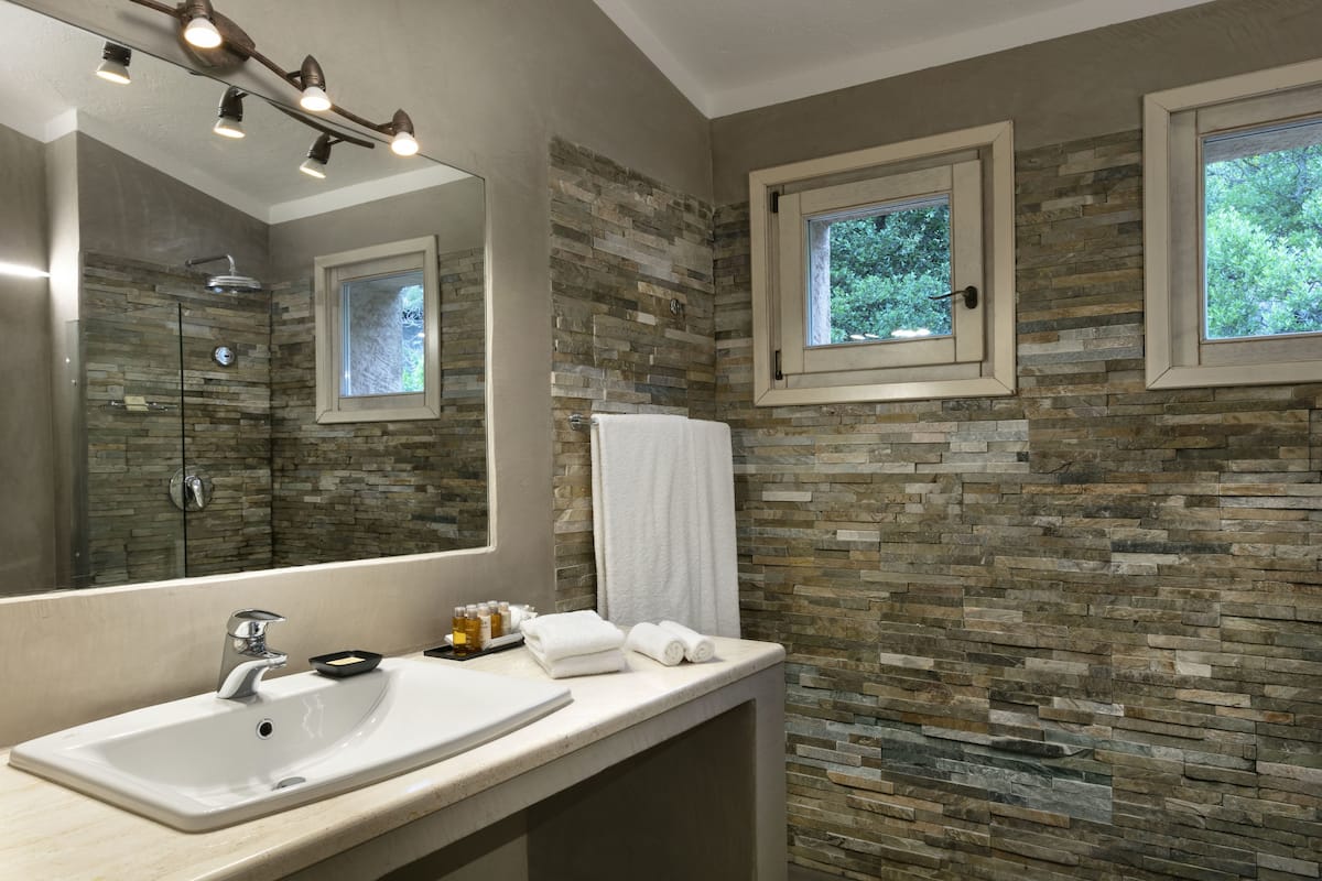 charming room | bathroom | designer toiletries, hair dryer, bathrobes, slippers