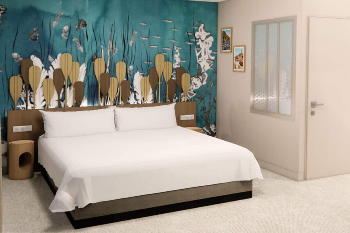 A bedroom with a bed, a wall mural, a window, and a door.
