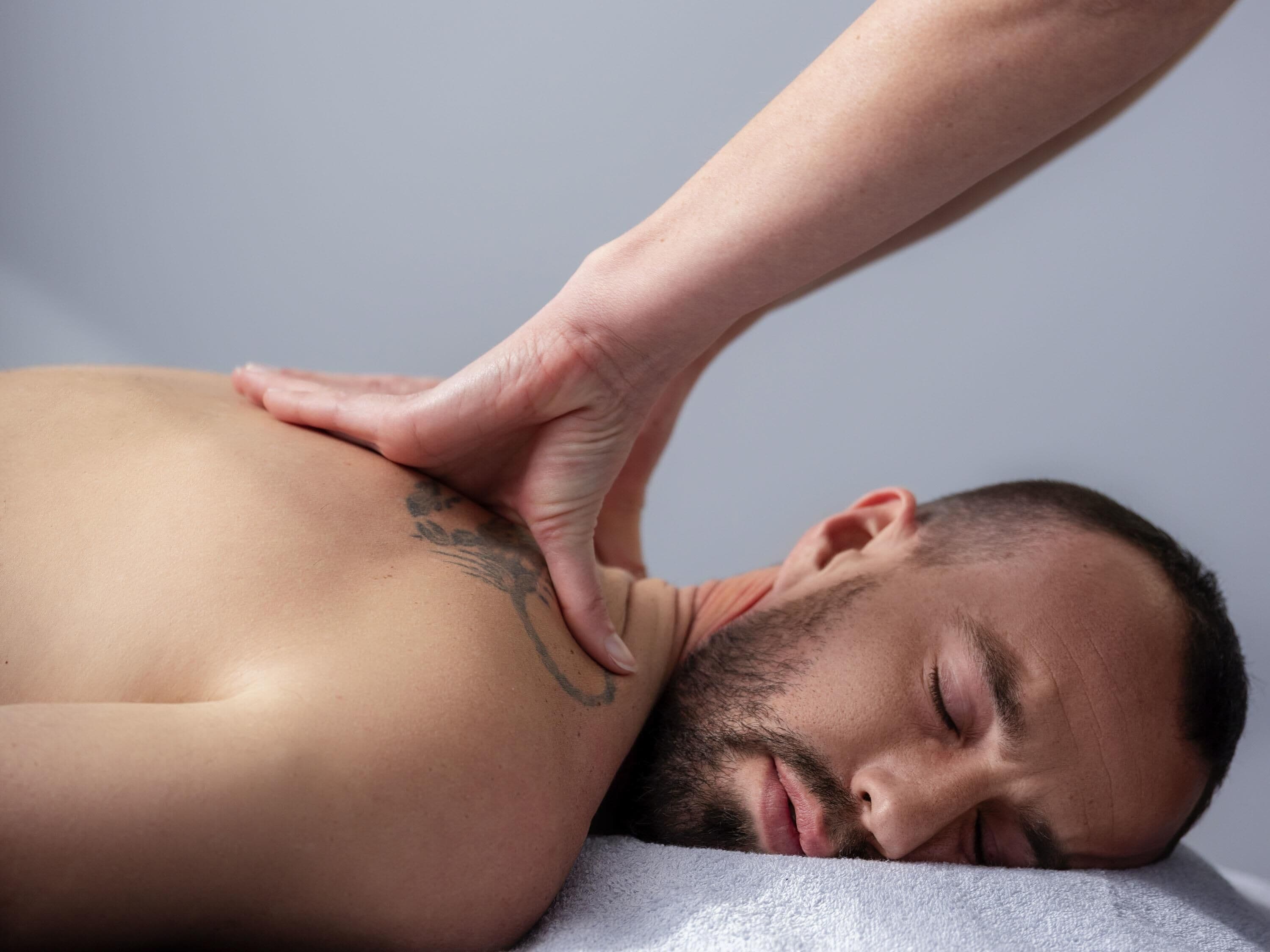 A person receiving a back massage.