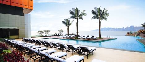 Seasonal outdoor pool, open 8:00 AM to 8:00 PM, pool umbrellas