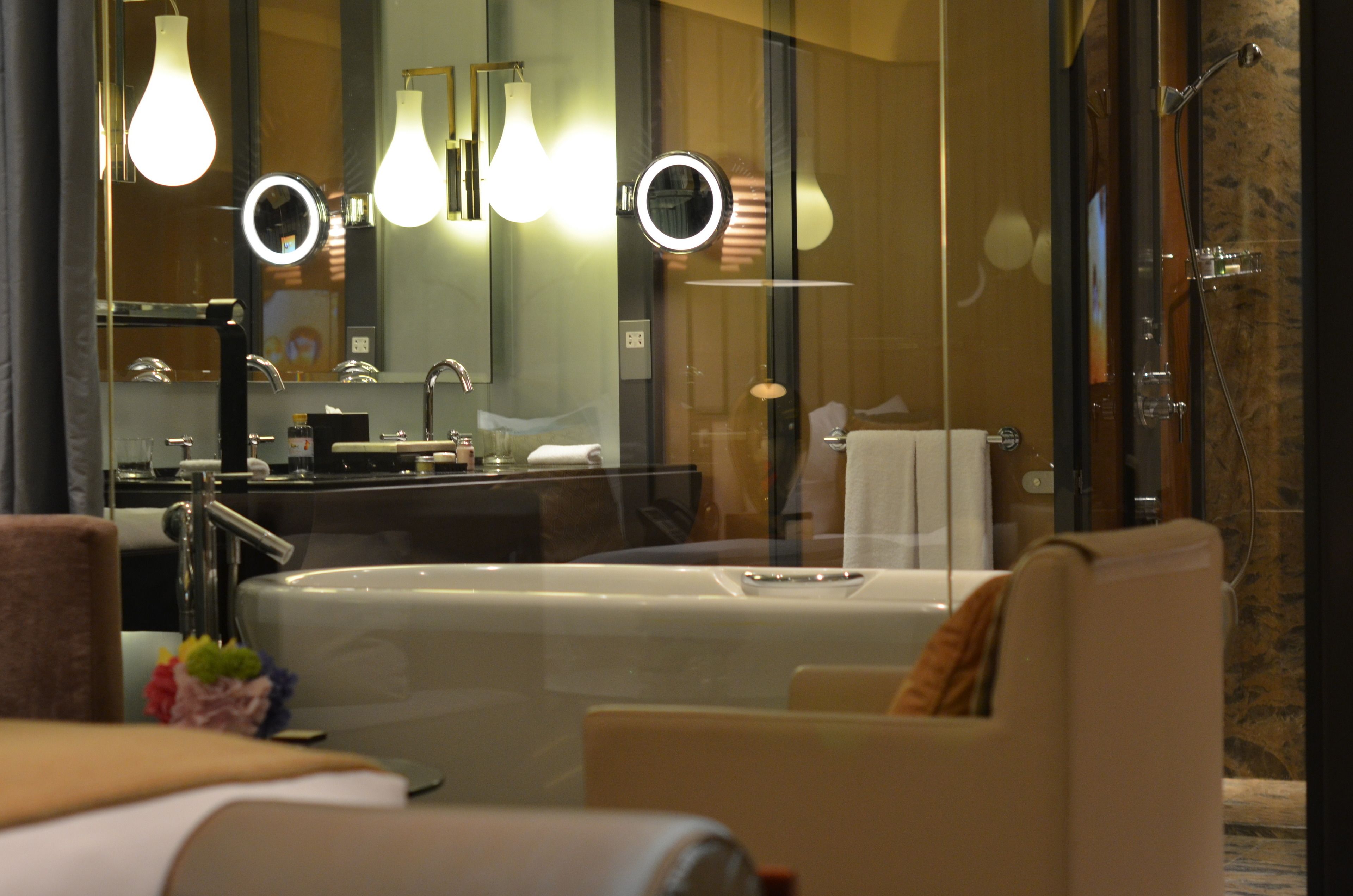 separate bathtub and shower, rainfall showerhead, designer toiletries