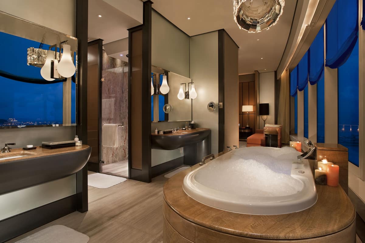 separate bathtub and shower, rainfall showerhead, designer toiletries