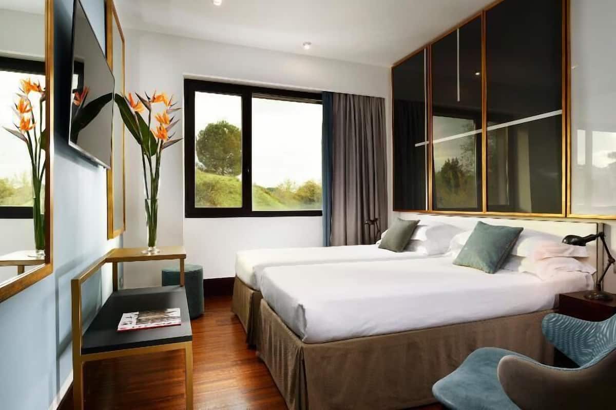Premium bedding, down comforters, pillowtop beds, minibar