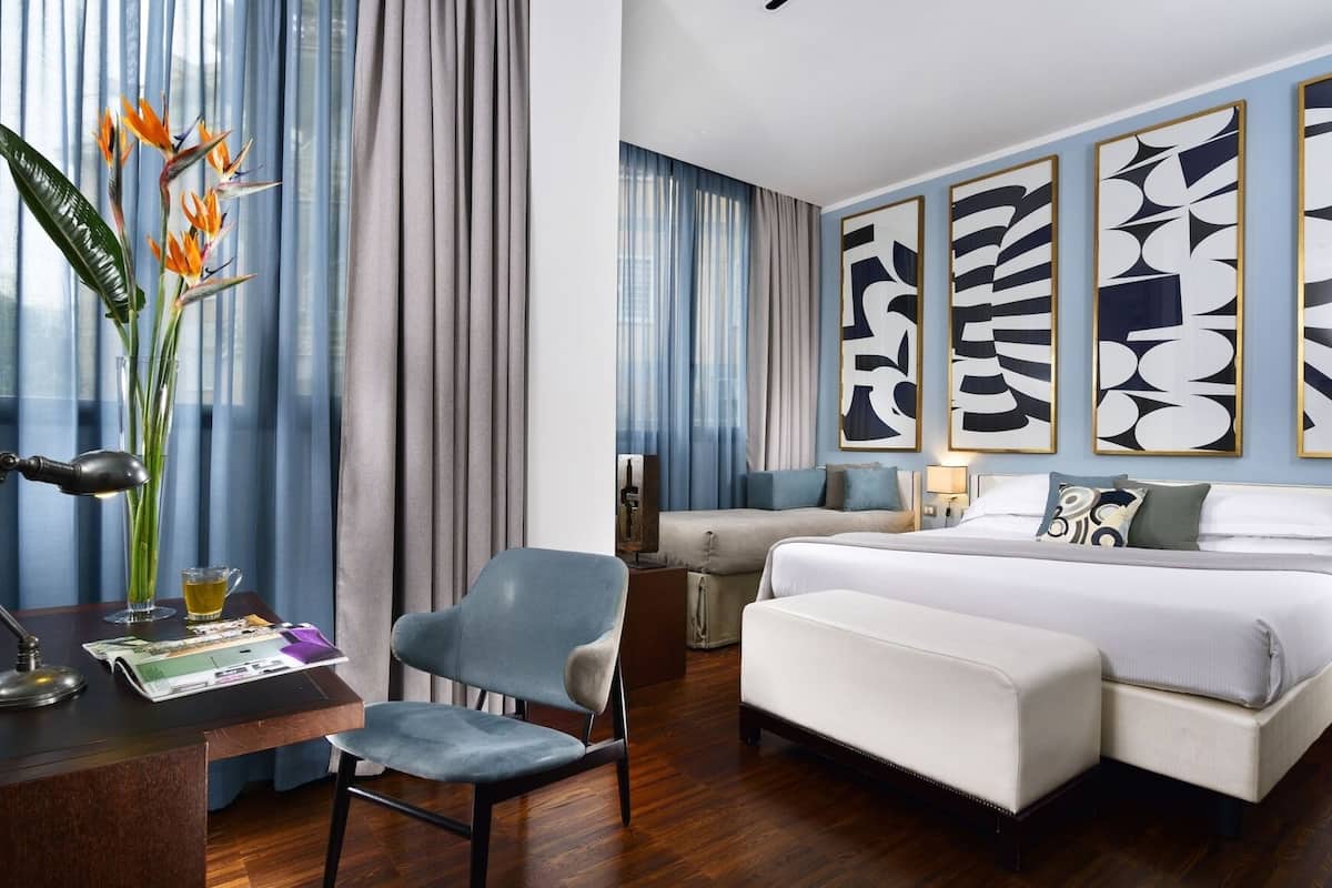 Premium bedding, down comforters, pillowtop beds, minibar