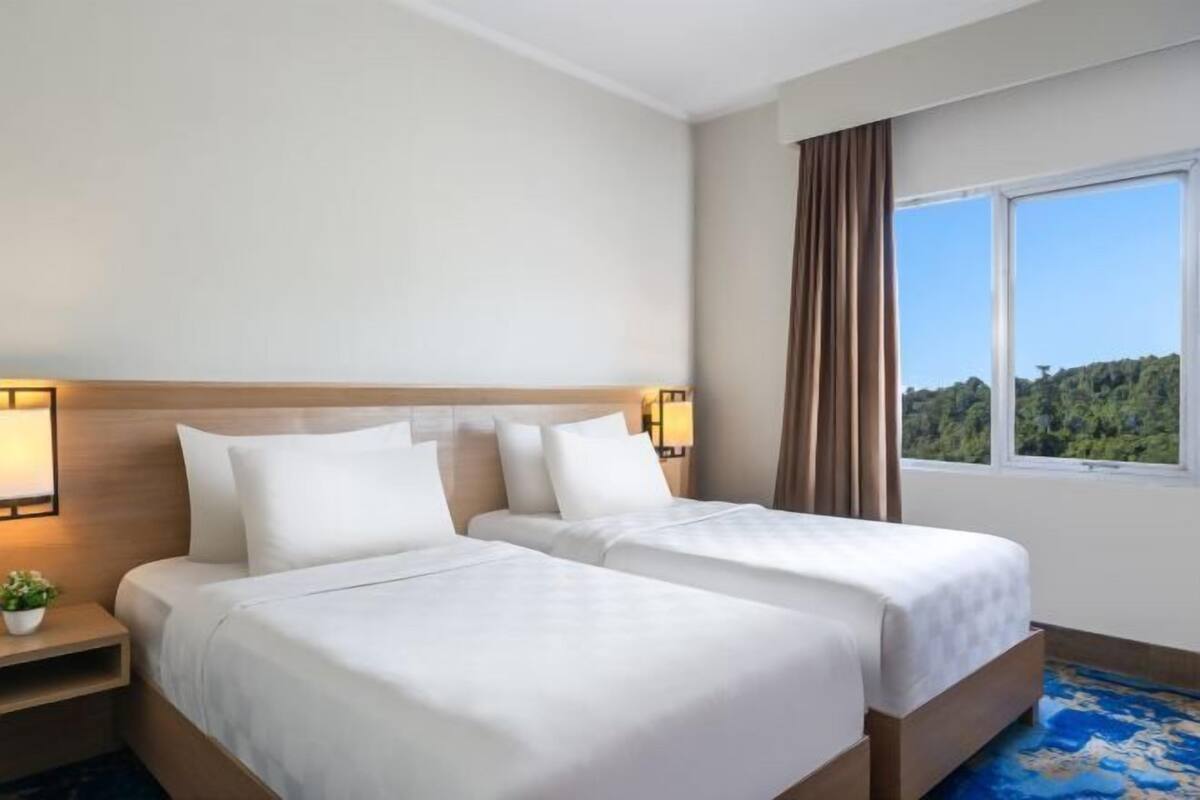 Ropa de cama de alta calidad, minibar, caja fuerte y escritorio