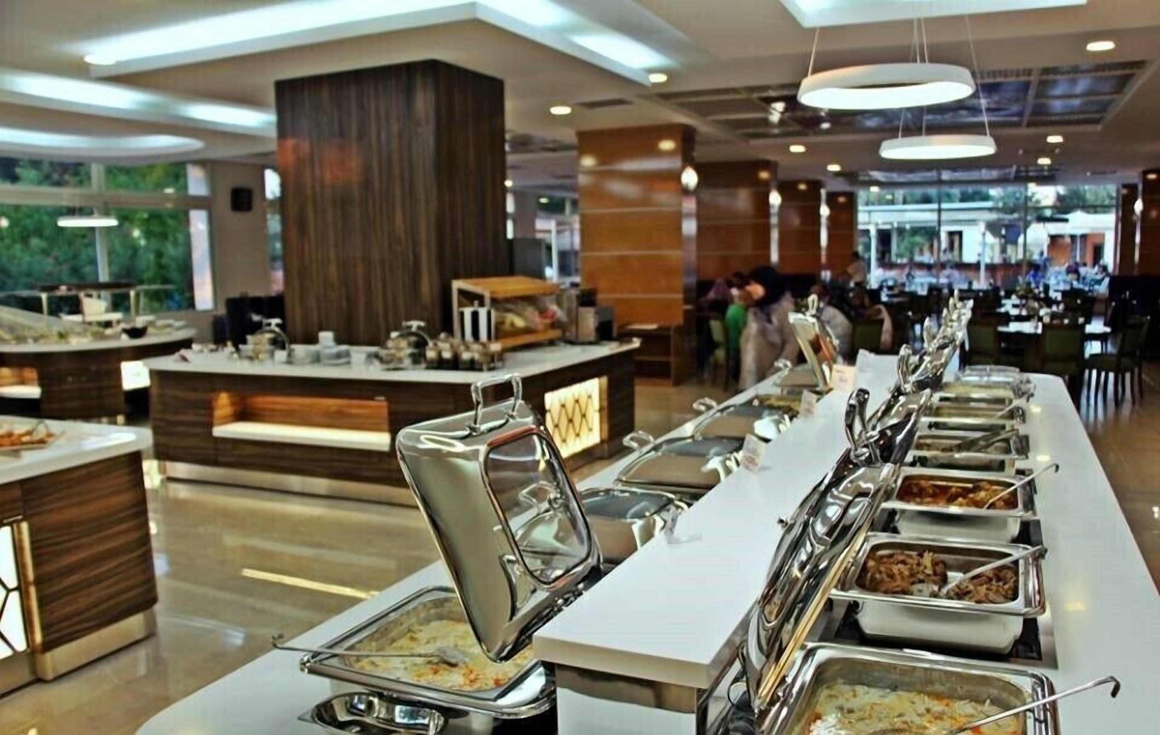A buffet setup with multiple food stations and a central serving area.