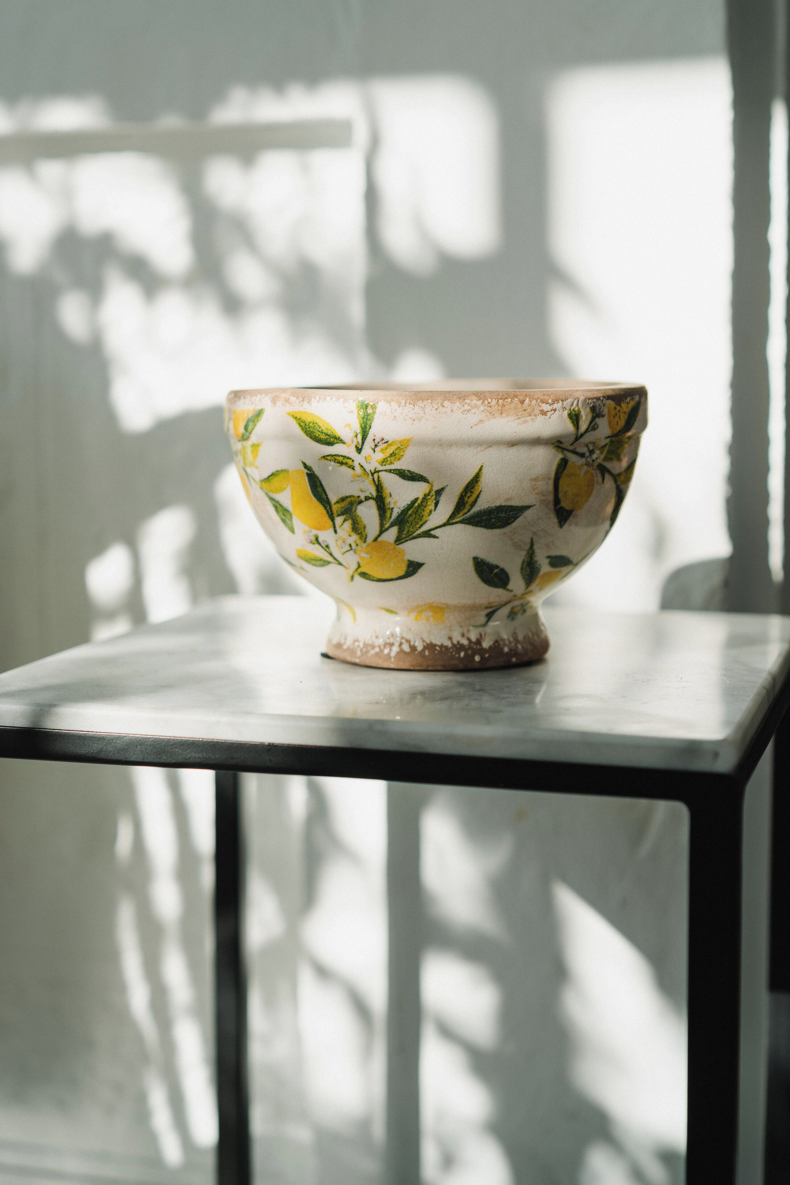A bowl with a floral pattern on a table.