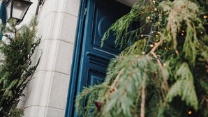A building facade with a sign reading "Villa Des Rosiers" and a blue door. - Hotel Edouard VII (Biarritz)