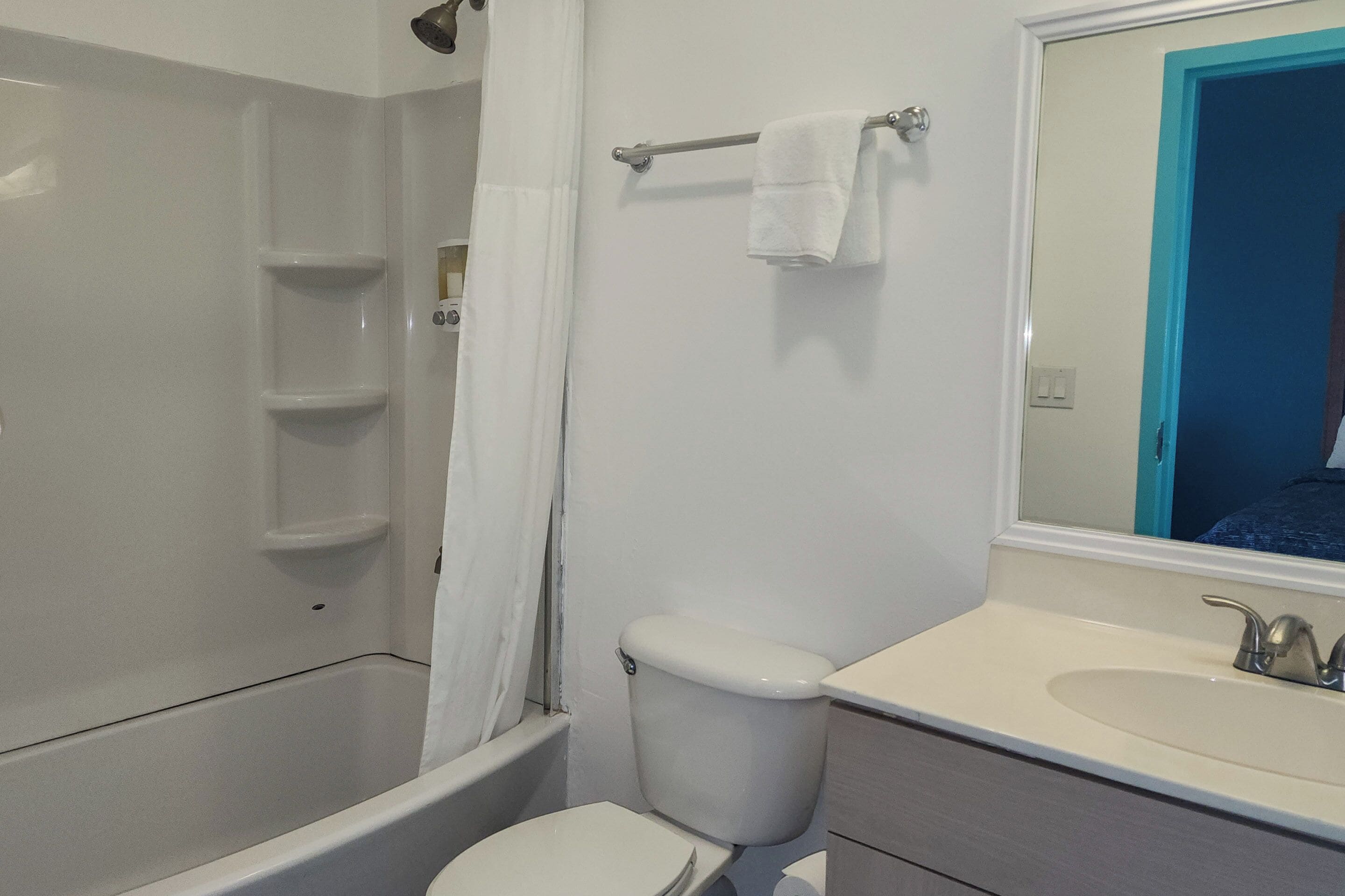 room, 2 queen beds, refrigerator & microwave, courtyard area | bathroom | free toiletries, hair dryer, towels