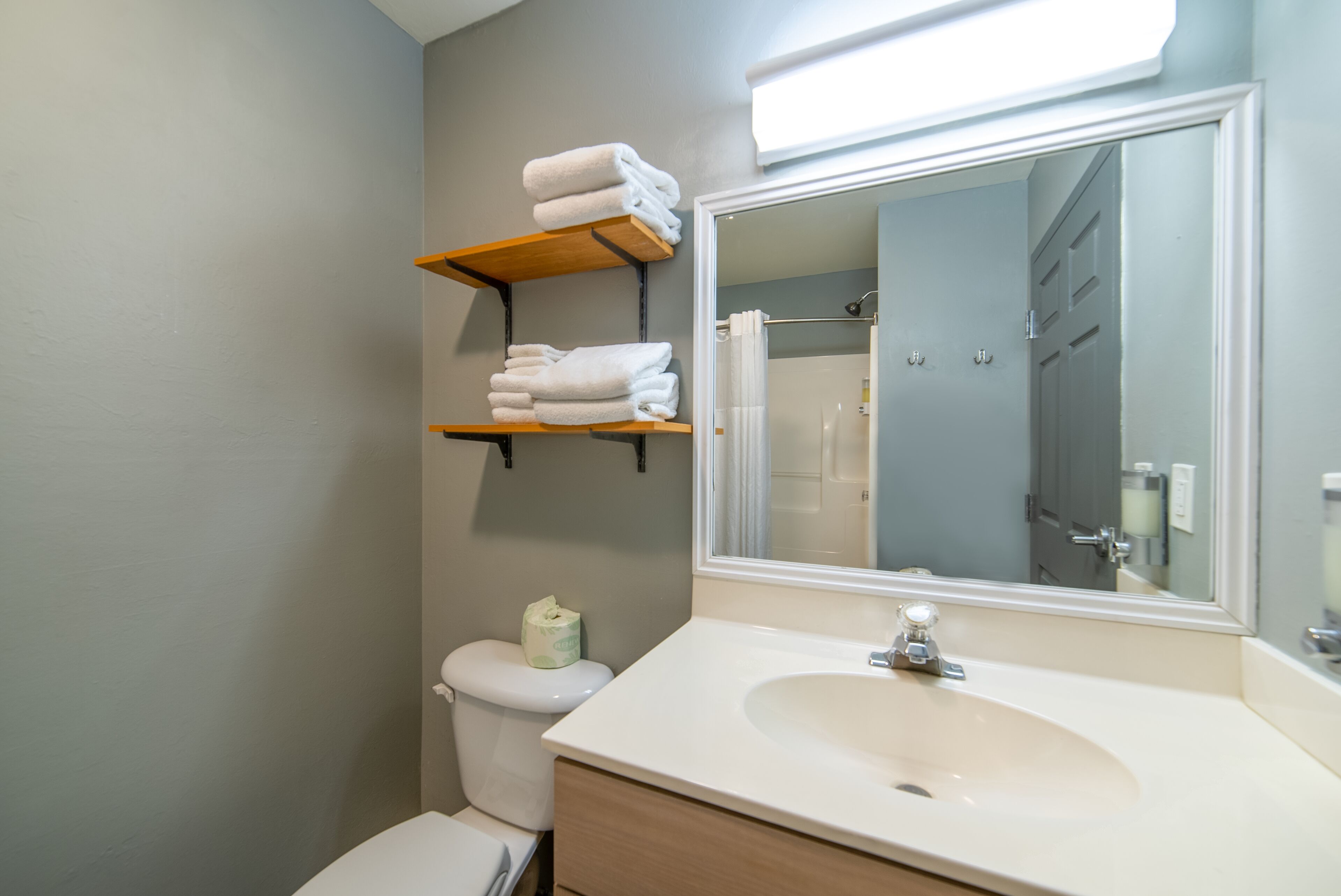 deluxe room, 2 queen beds, refrigerator & microwave | bathroom | free toiletries, hair dryer, towels