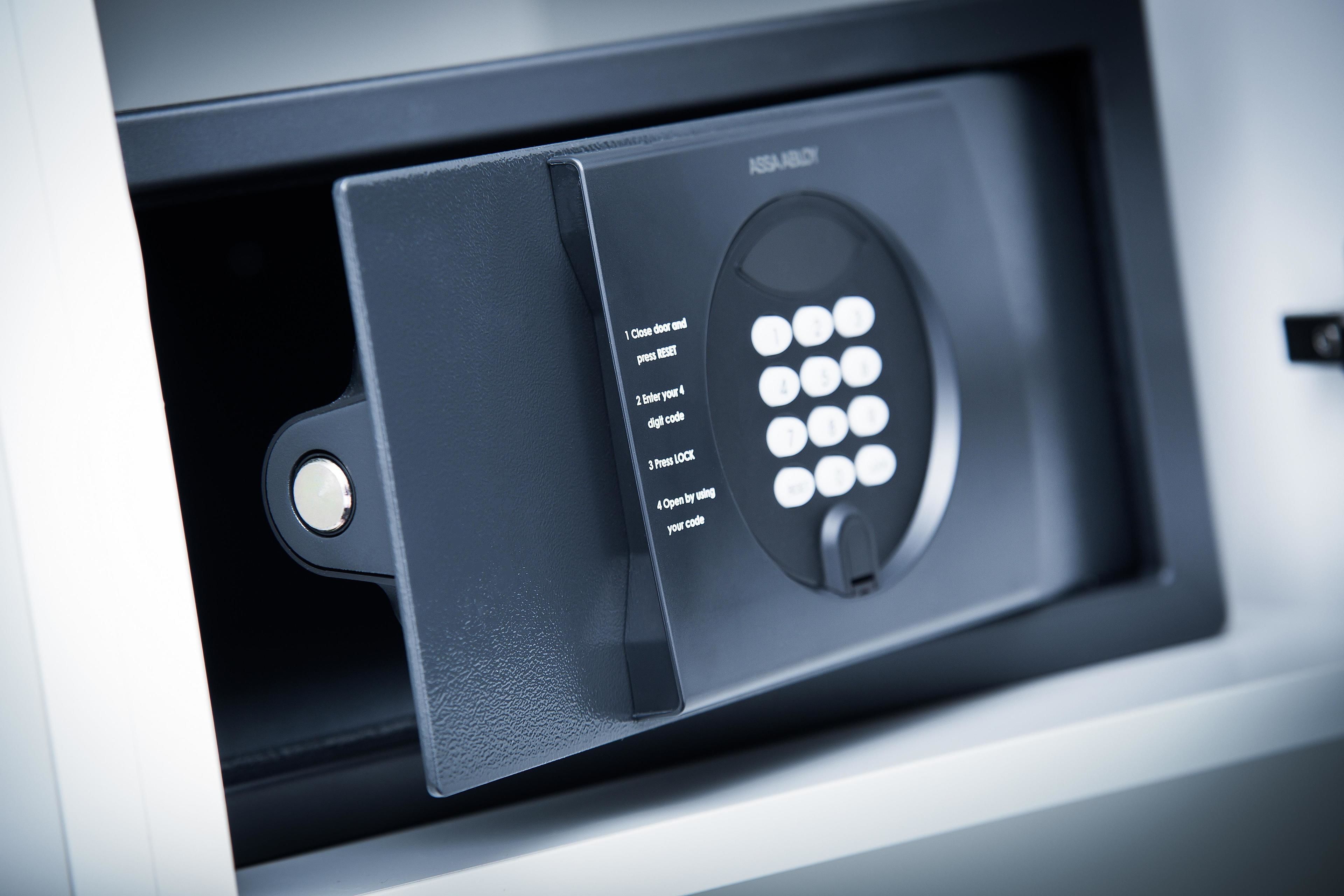 A close-up of a digital keypad lock with instructions for use.