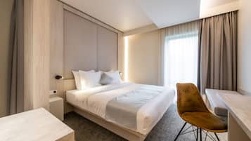 Hypo-allergenic bedding, minibar, in-room safe, desk