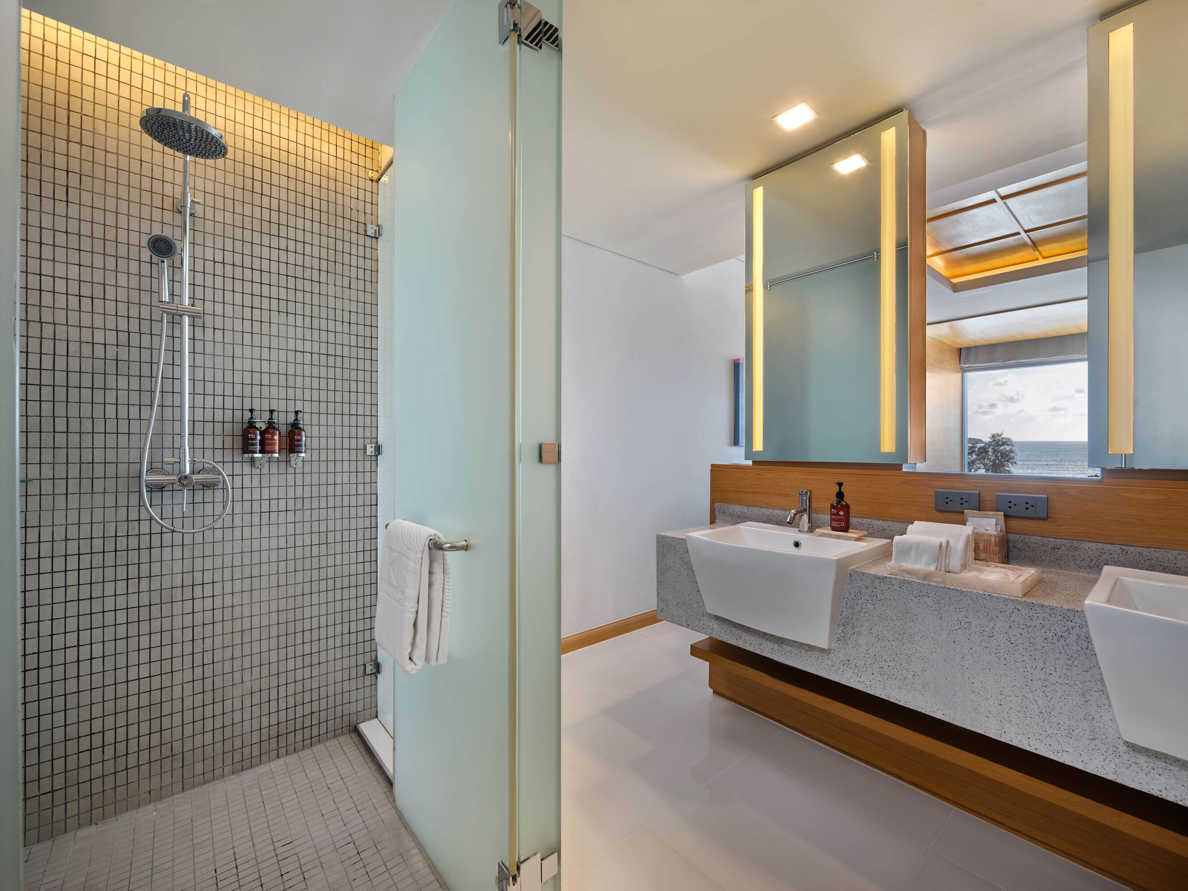 sea view suite | bathroom | designer toiletries, hair dryer, bathrobes, slippers