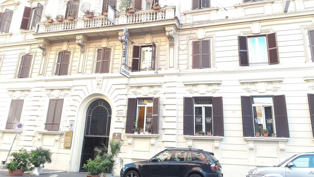 A historic building with a sign indicating a hotel named "Hotel Cambridge." - Aristotele Hotel (Rome)