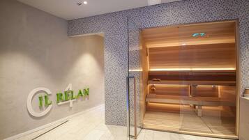 A modern spa entrance with a glass door, a wooden bench inside, and a tiled mosaic wall.