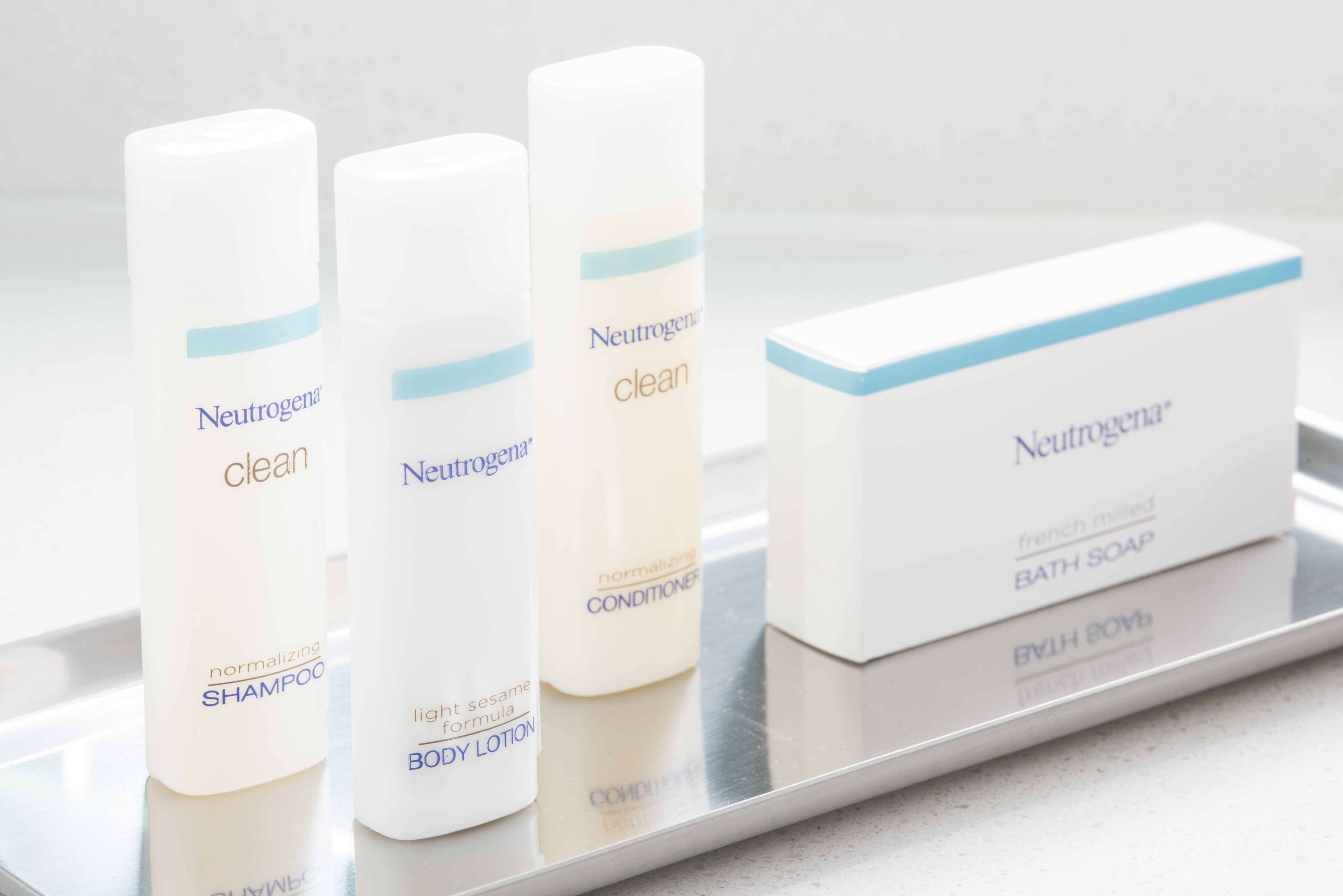 designer toiletries, hair dryer, towels, soap