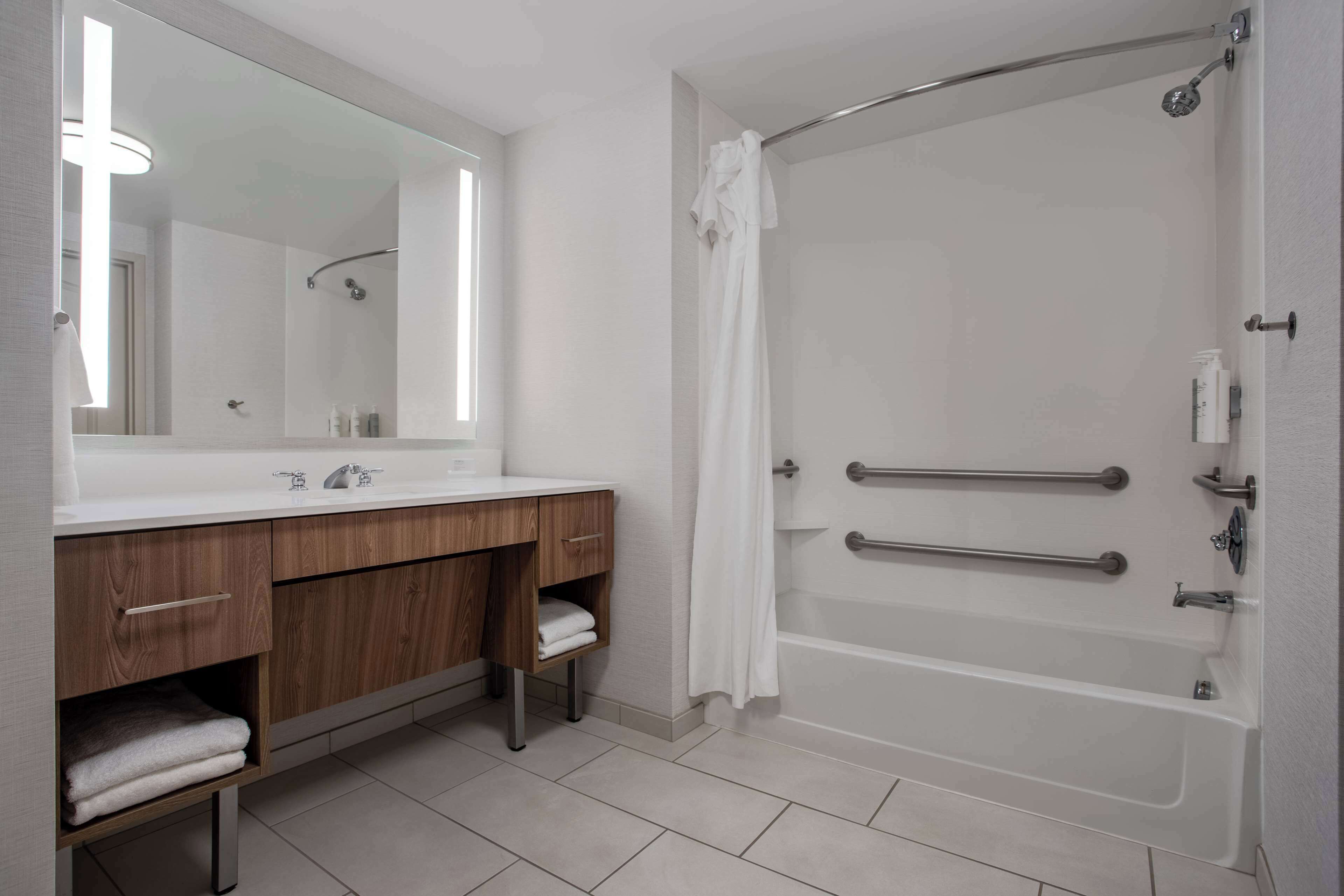 bathtub, free toiletries, hair dryer, towels