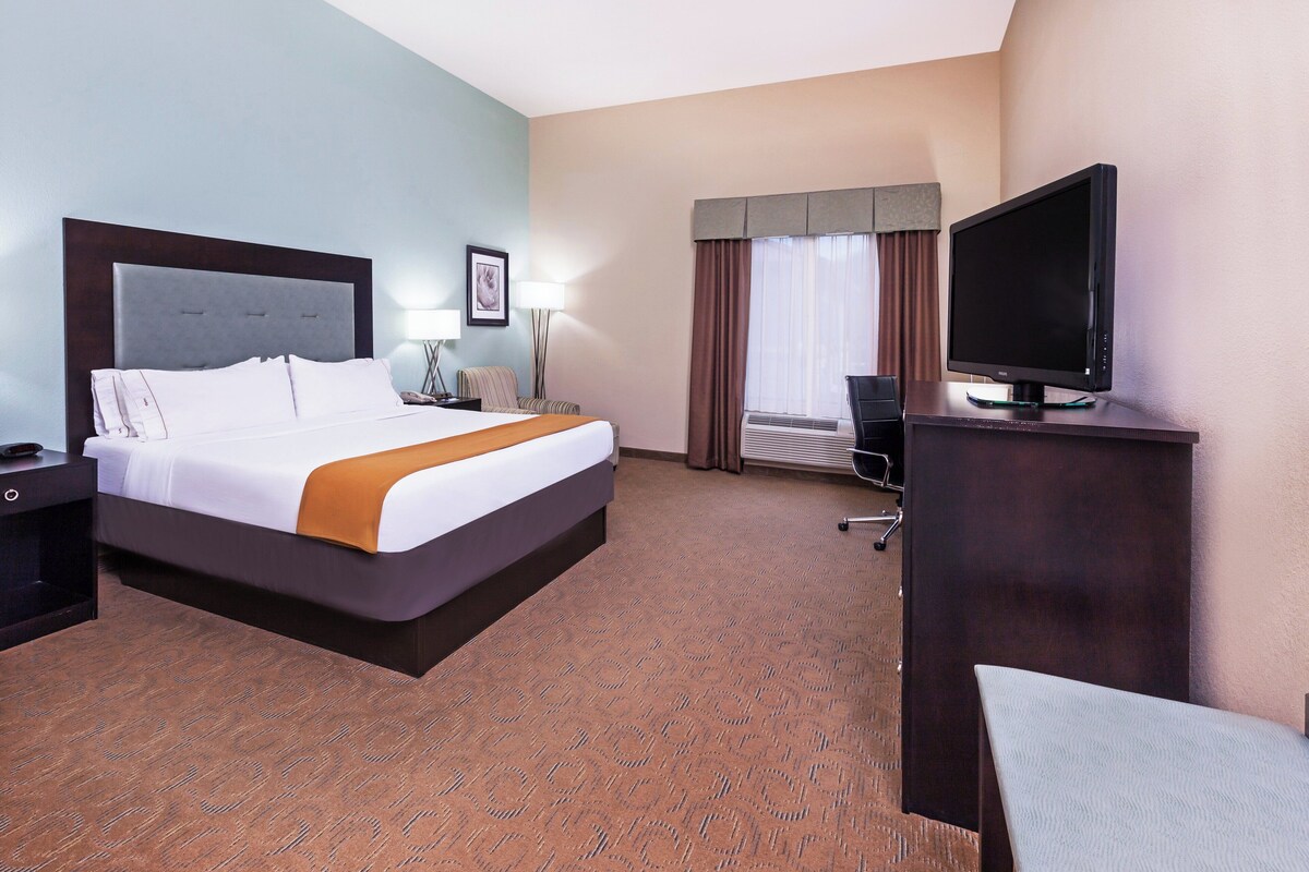 Premium bedding, desk, laptop workspace, iron/ironing board