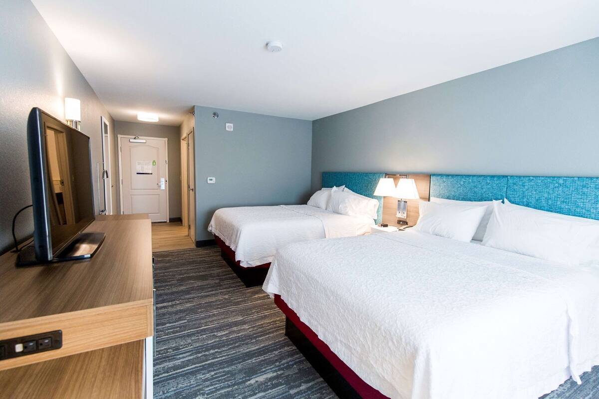 Hypo-allergenic bedding, pillowtop beds, desk, laptop workspace