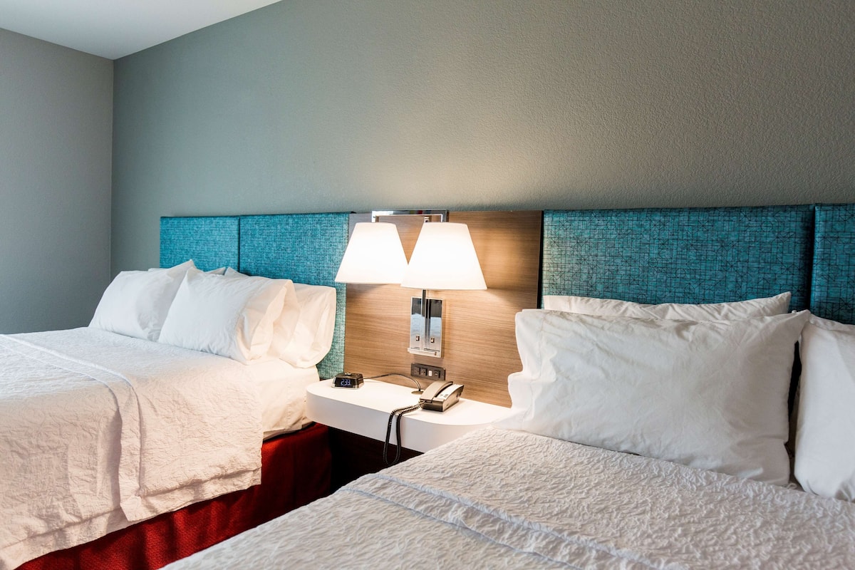 hypo-allergenic bedding, pillow-top beds, desk, laptop workspace