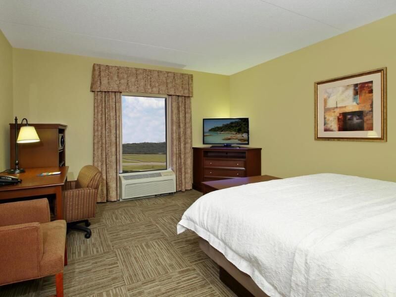 Desk, laptop workspace, blackout drapes, iron/ironing board