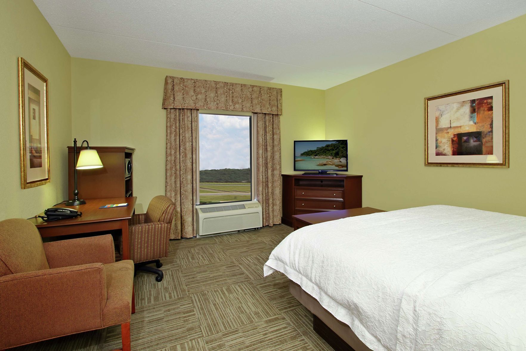 Desk, laptop workspace, blackout drapes, iron/ironing board