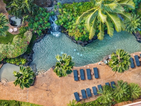 Outdoor pool, pool loungers. Kahana Falls Maui by VRI Americas