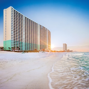 A beachfront hotel with multiple floors, a sandy beach, and the ocean. - Club Wyndham Panama City Beach (Panama City Beach)