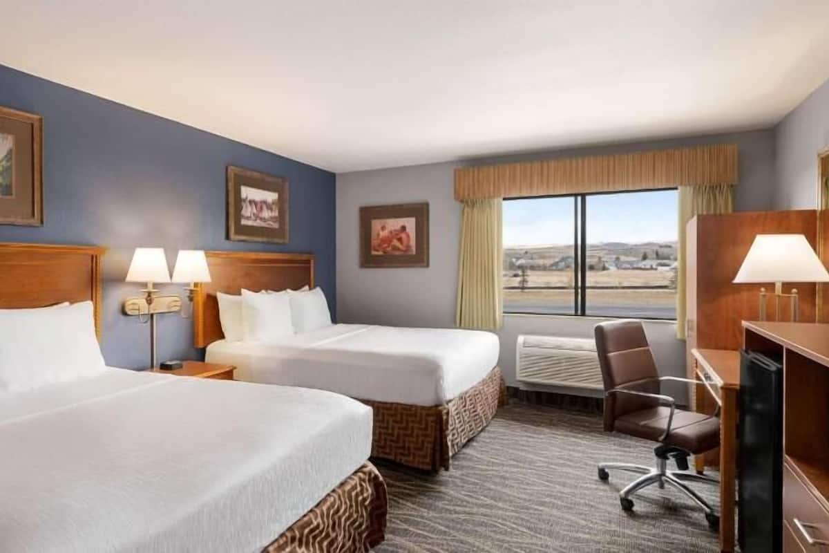 Premium bedding, pillowtop beds, desk, blackout drapes