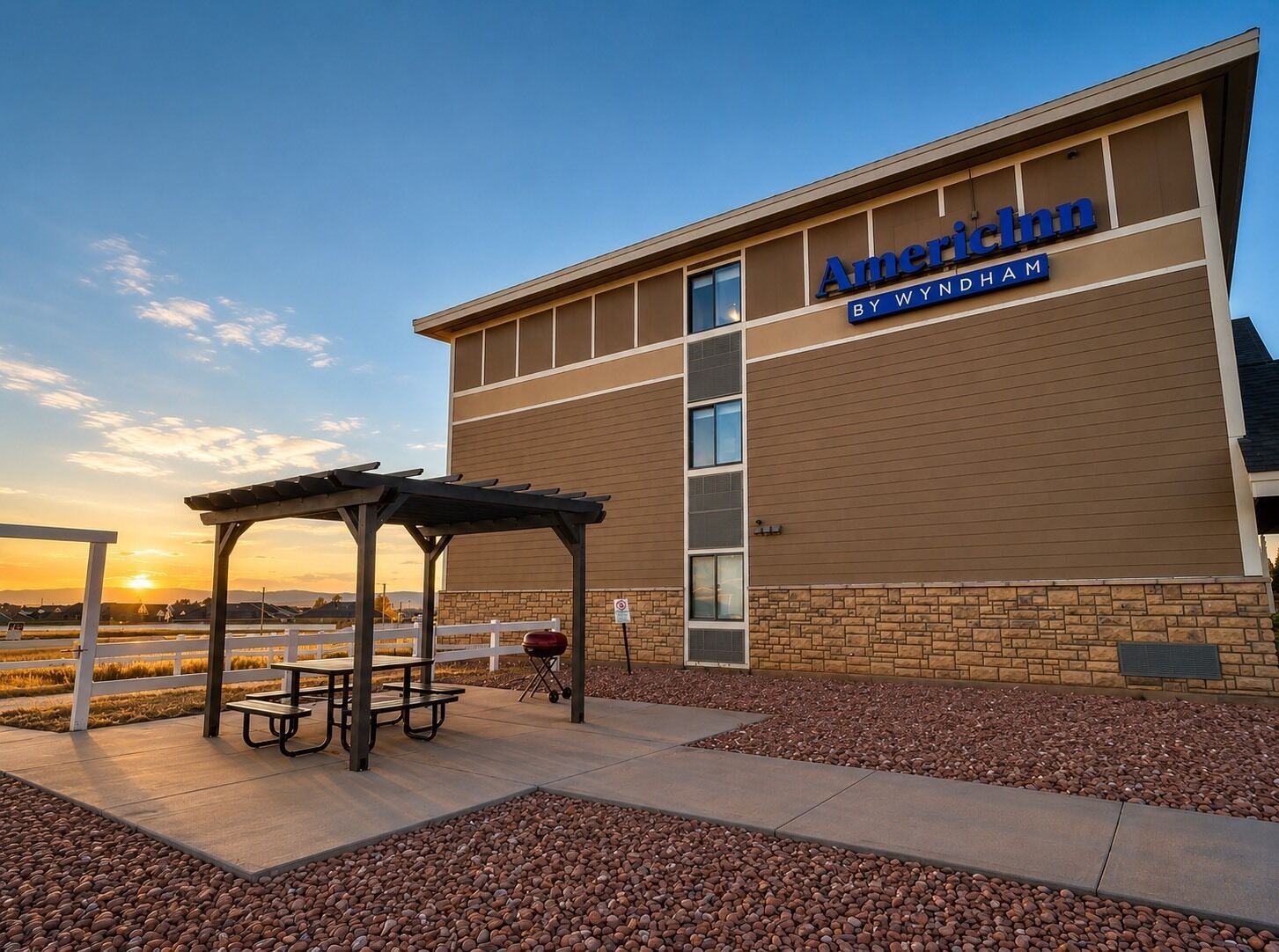 A building with a sign reading 'American Inn By Wyndham.'