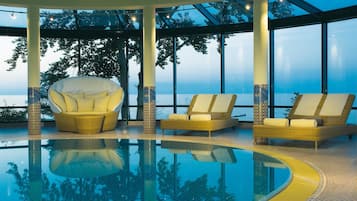 Indoor pool, pool umbrellas, pool loungers