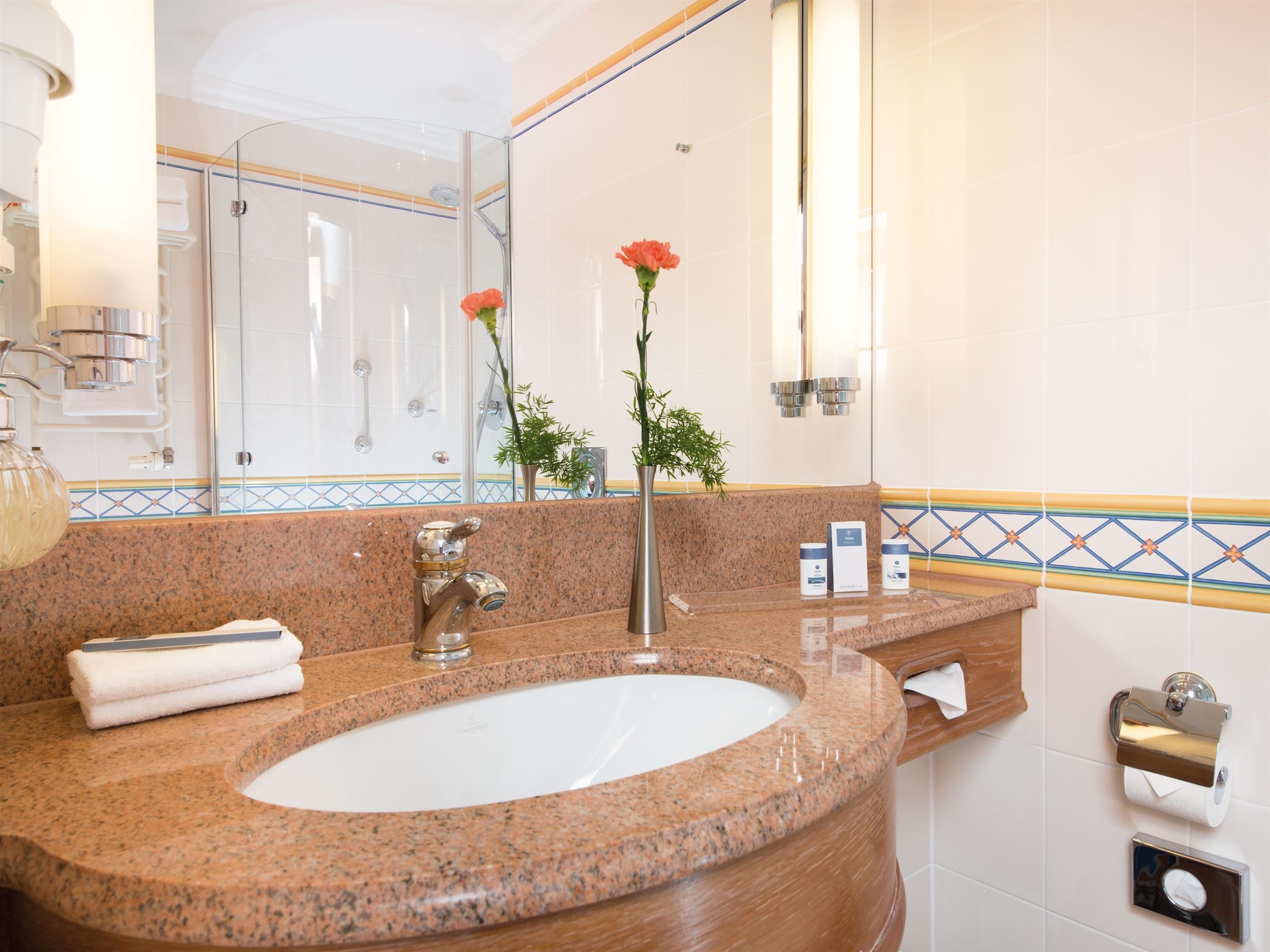 eco-friendly toiletries, hair dryer, bathrobes, towels