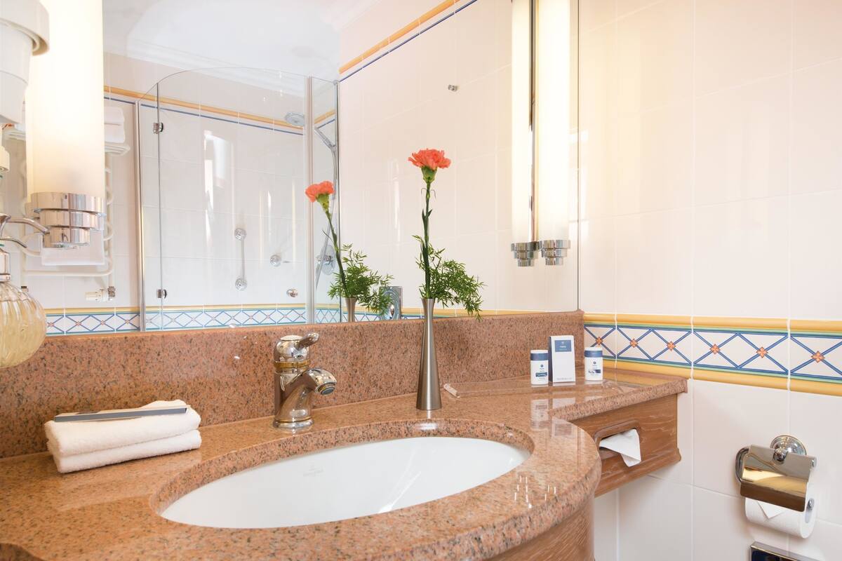 eco-friendly toiletries, hair dryer, bathrobes, towels