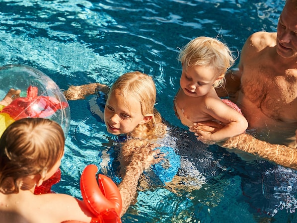 Indoor pool, open 7:00 AM to 10:00 PM, pool umbrellas, pool loungers
