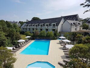 Seasonal outdoor pool, open 9:30 AM to 7:30 PM, pool umbrellas