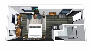 Una cocina moderna con una isla central, un comedor con mesa y sillas, y un área de baño separada.