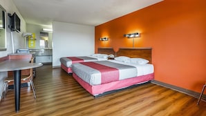 A hotel room with two beds, a small kitchenette, and a dining area. - Motel 6 Mount Vernon, IL (Mount Vernon)