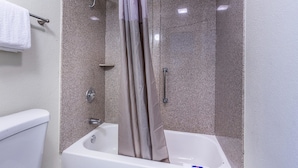 A bathroom with a shower, a bathtub, and a toilet. - Motel 6 Mount Vernon, IL (Mount Vernon)