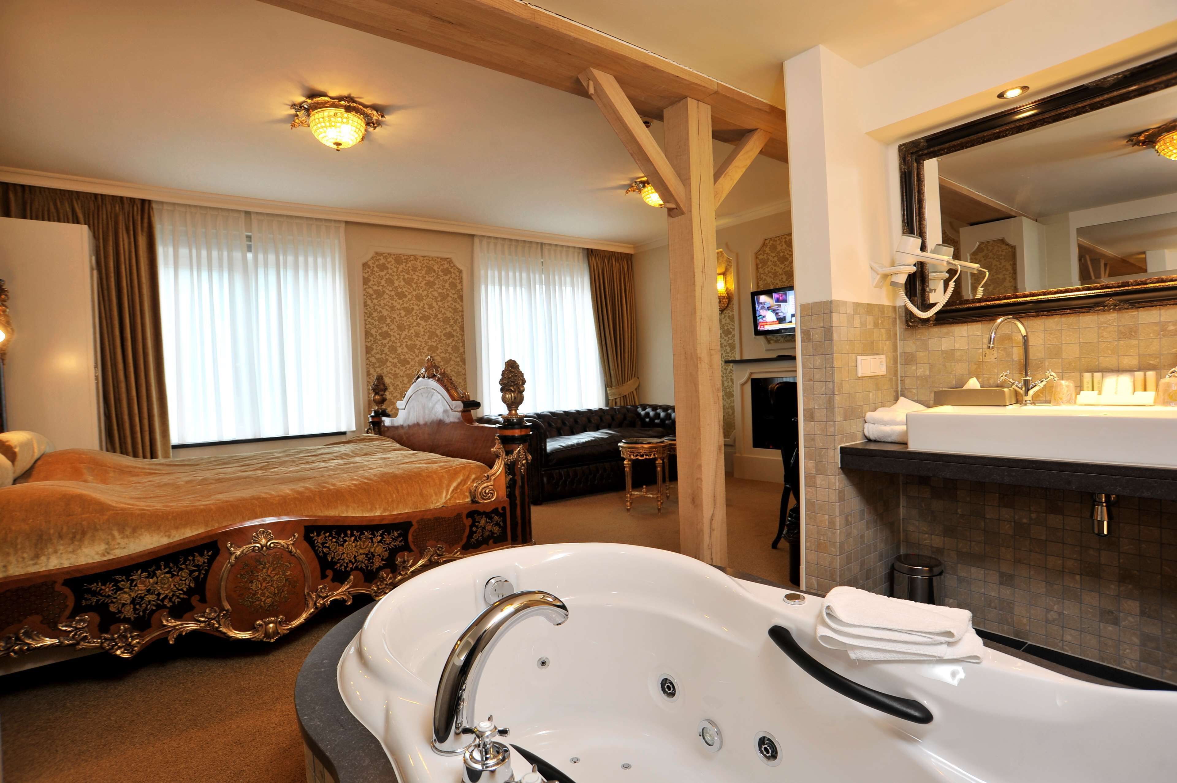 superior suite, multiple beds (theme) | bathroom | combined shower/bathtub, eco-friendly toiletries, hair dryer, towels