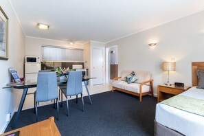 Deluxe Room, Multiple Beds, Non Smoking, Kitchenette | Living area