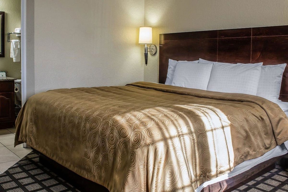 Pillowtop beds, desk, blackout drapes, iron/ironing board